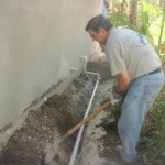 Bryan working on drain ditch for washer