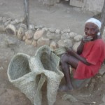 Lady weaving basket