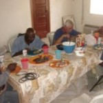 Chris (Global Outreach) with drilling team having lunch at mission house