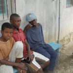 Boys outside mission house Boys outside mission house