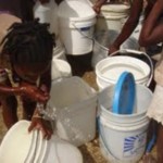 Filling buckets of water