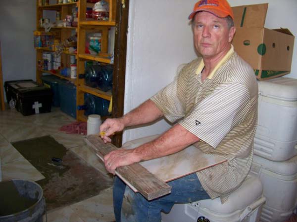 Bruce laying tile