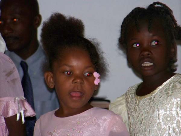 Young girls singing in church