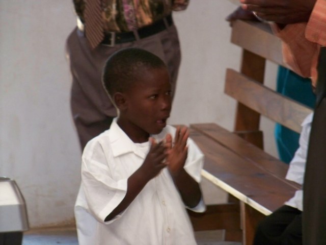 Little boy praising Lord