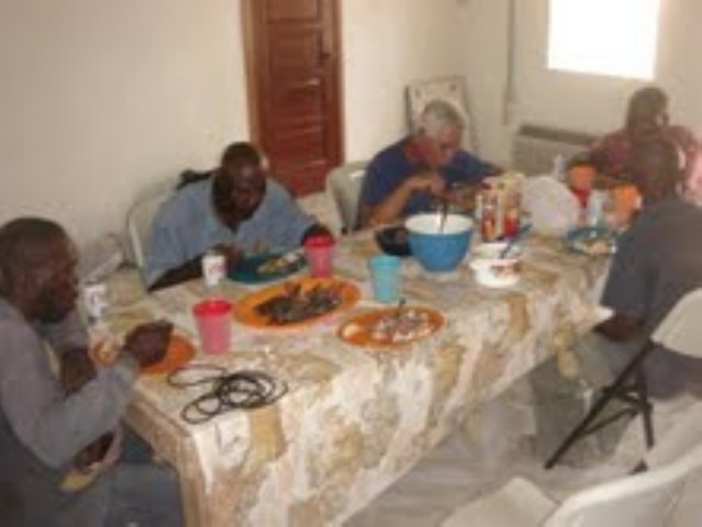 Chris (Global Outreach) with drilling team having lunch at mission house