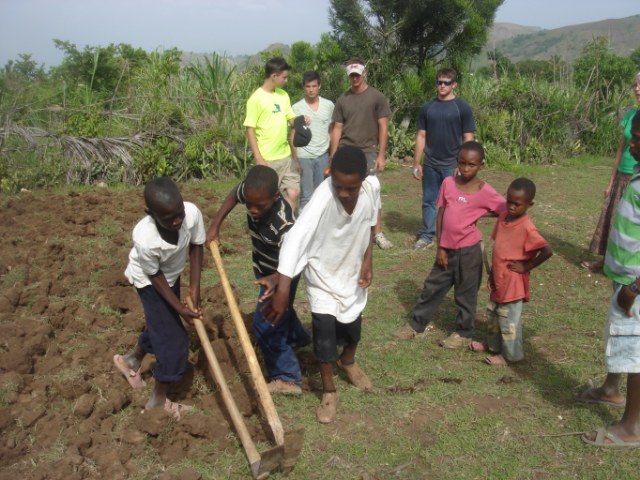 Joe, Will, Cooper & Adam getting a lesson from the Haitian kids